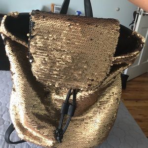 Gold and black sequent backpack